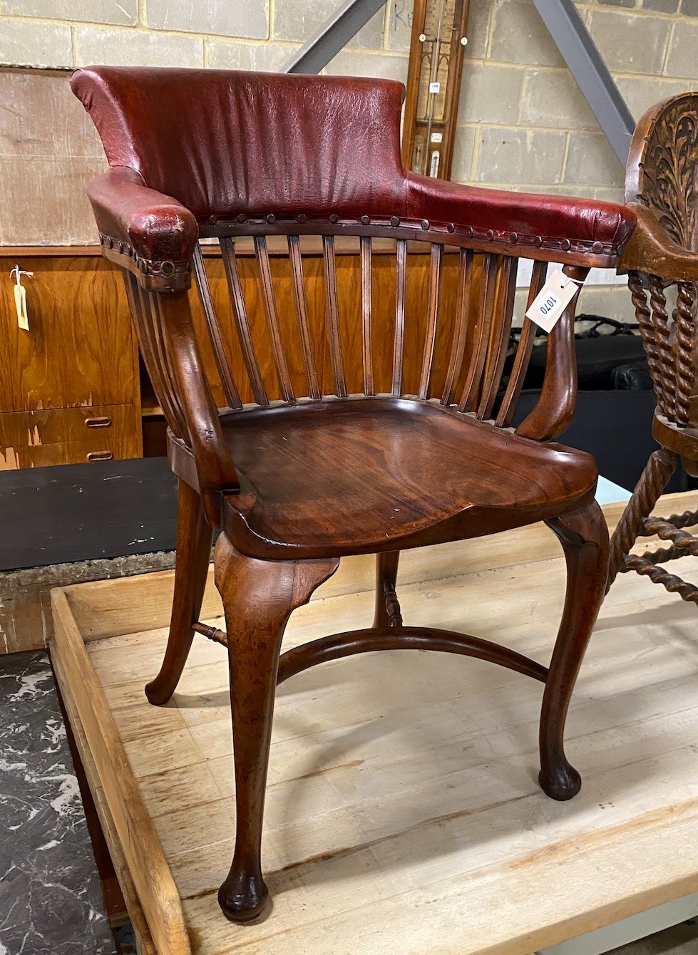 A Victorian mahogany part upholstered desk chair with saddle seat and crinoline stretcher, width 58cm, depth 45cm, height 87cm